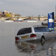 Illustration for article titled Rowers rescue flooded cars during boat race